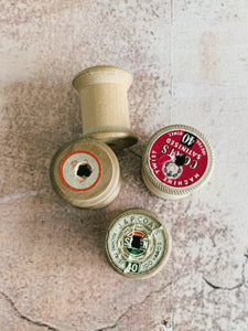 4 vintage small cotton reels -empty