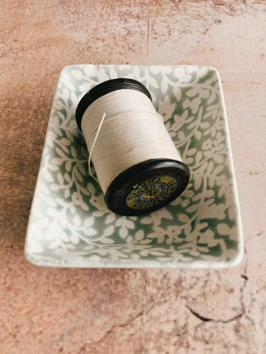 A vintage wooden thread spool - ivory linen thread